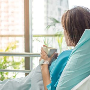 An acute care patient in a hospital bed.