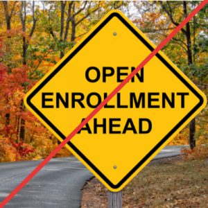 Yellow road sign reading "Open Enrollment Ahead", with a red strike through the whole image, indicating that it will be difficult for Michigan residents who lost insurance due to COVID-19 to access ACA coverage.