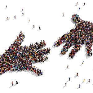 People stand in large groups shaped like two hands reaching toward each other, symbolizing trust and information seeking.