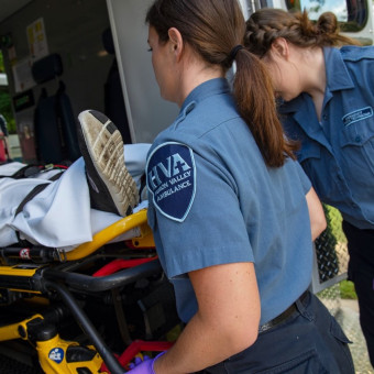 Community paramedics prepare patient for transport