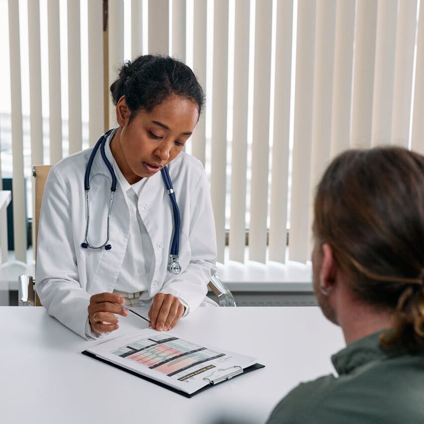 Doctor fills out questionnaire with patient