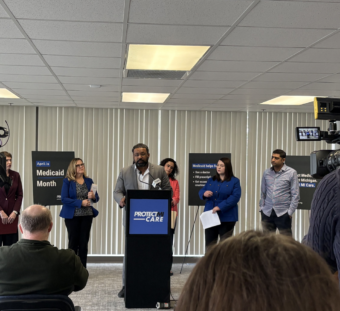 Joshua Traylor, CHRT executive director, speaks at a press conference to protect Medicaid.